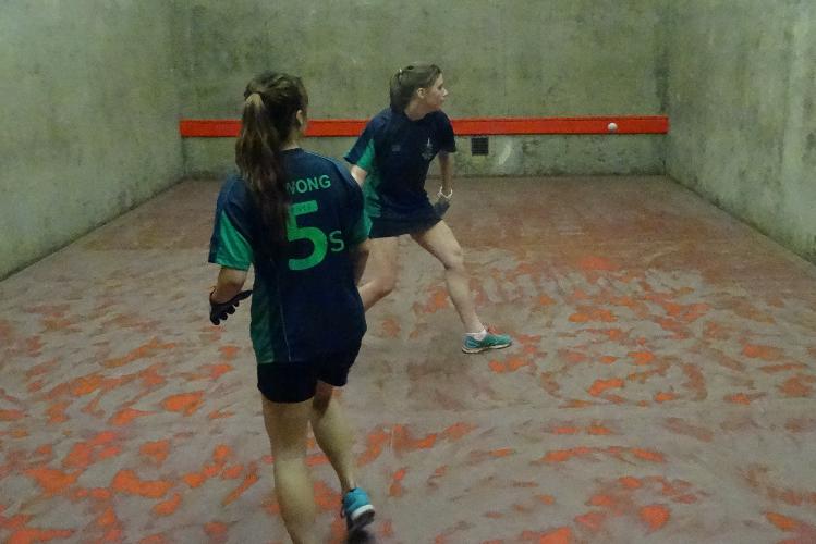 The U18 Singles winner serving