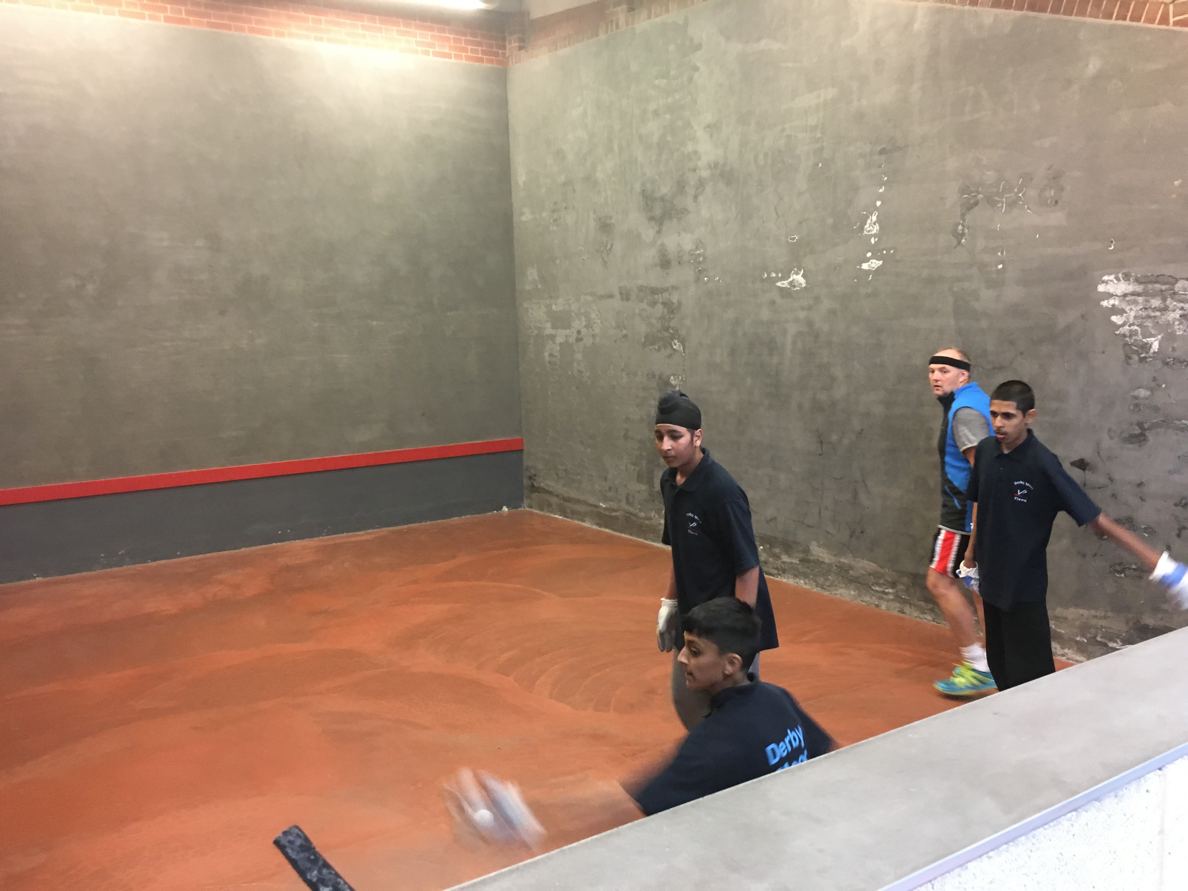 Hamish giving a master class to three youngsters