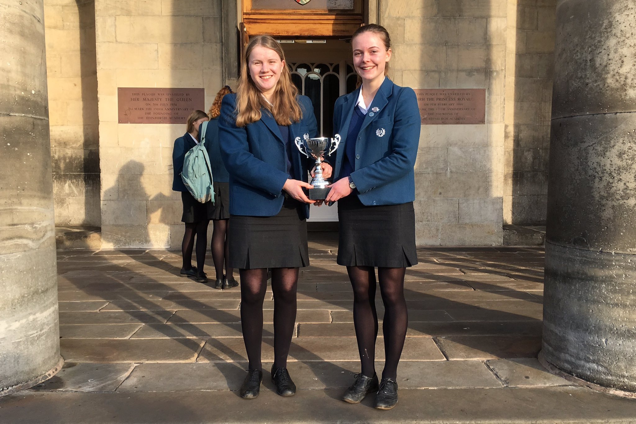 The proud winners with their trophy