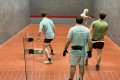 Emrys receiving serve in the Cambridge Past v Present 2022