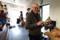 Bob Dolby polishing the Cyriax Cup at the National Doubles 2022