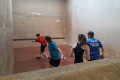Ollie serving at the Winchester Fives Mixed Doubles at Malvern